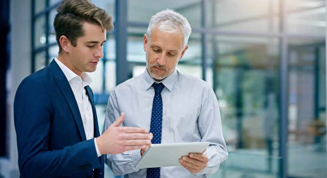 Two CRE professionals negotiating a commercial lease.